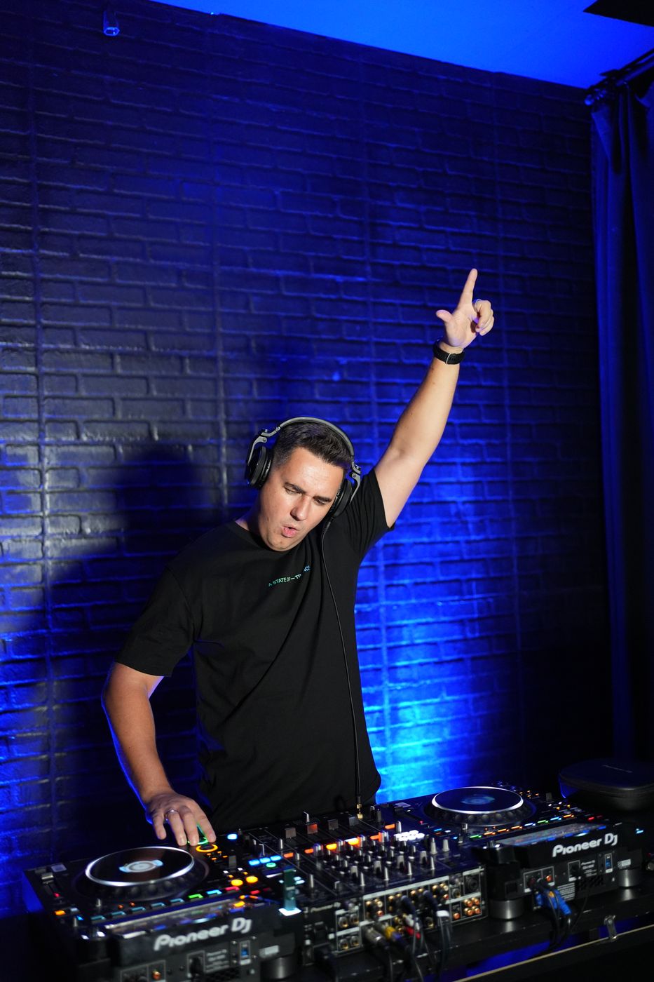David Matson at the decks, arm raised